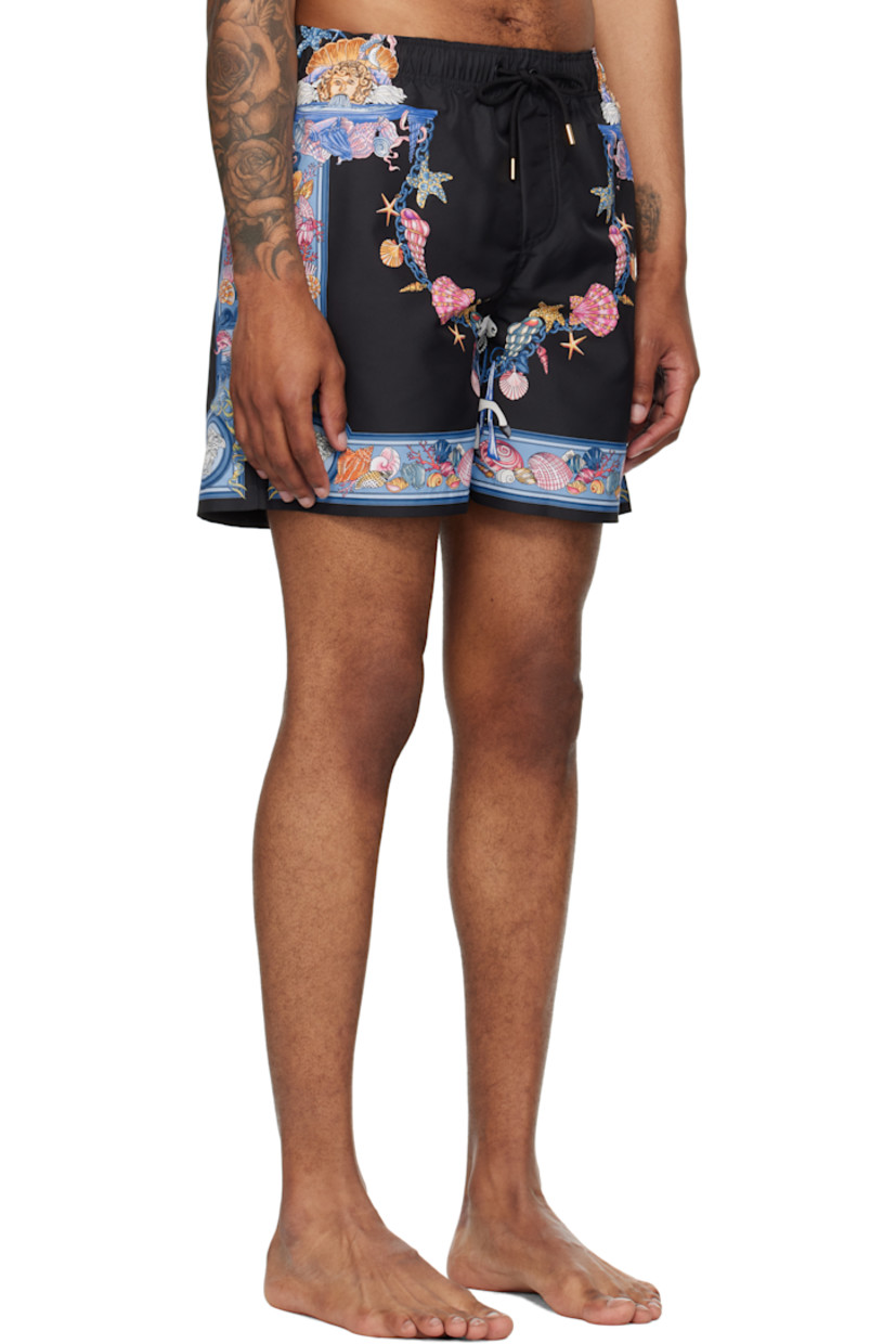 Taffeta swim shorts.

· Logo graphic pattern printed throughout
· Drawstring at elasticized waistband
· Three-pocket styling
· Mock fly
· Mesh brief-style lining
· Logo-engraved gold-tone hardware

Part of the La Vacanza collection.

Supplier color: Print