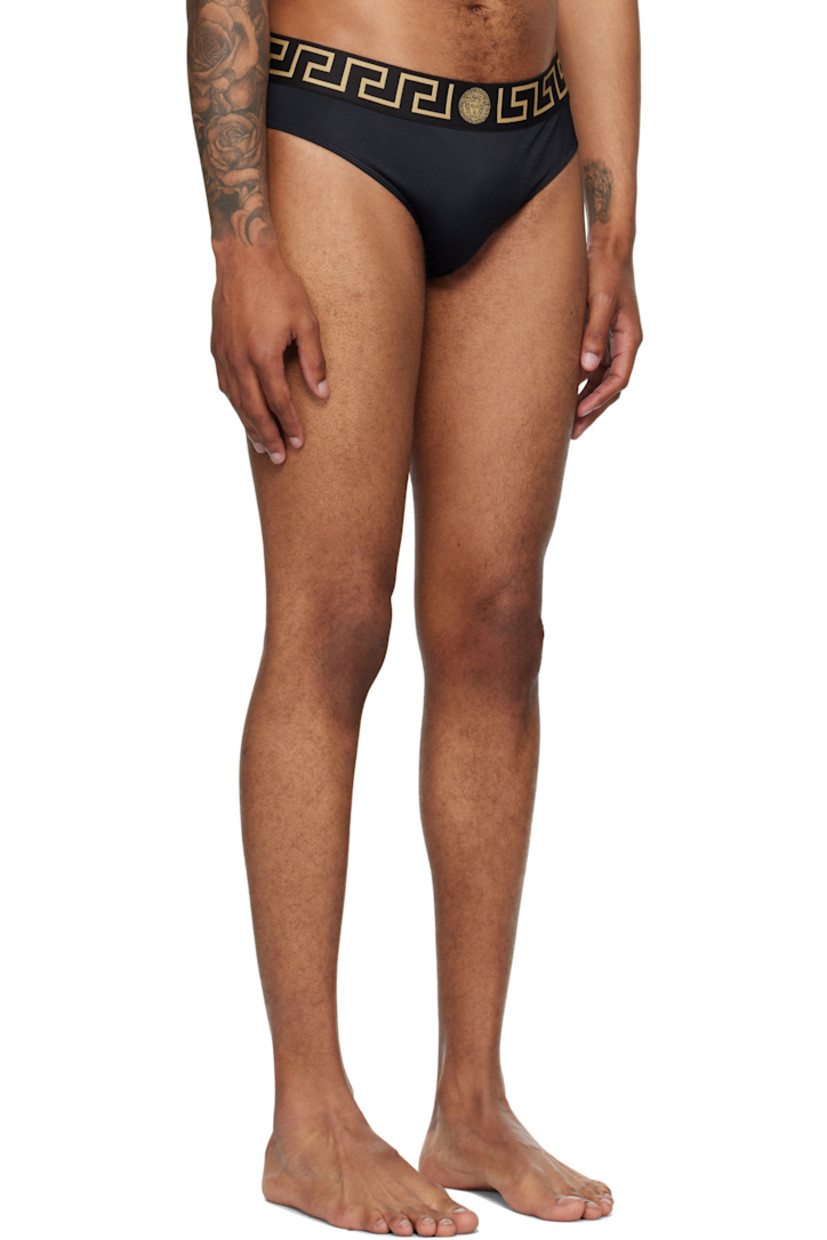 Stretch nylon jersey swim briefs.

· Medusa and Greek key pattern at elasticized waistband
· Dart at front
· Full stretch jersey lining

Supplier color: Black