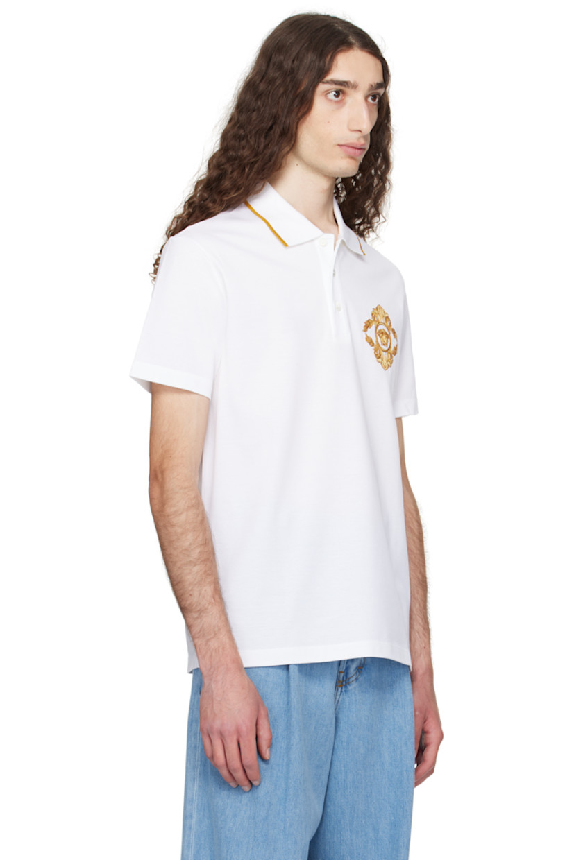 Cotton piqué polo. 

· Striped rib-knit spread collar
· Three-button placket 
· Embroidered logo graphic at chest

Supplier color: White