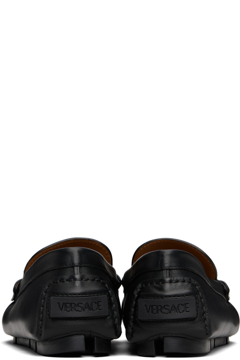 Calfskin loafers.

· Moc toe
· Medusa hardware at vamp strap
· Rubberized logo patch at heel counter
· Buffed goatskin lining
· Treaded rubber sole

Part of the La Vacanza collection.

Supplier color: Black/Gold