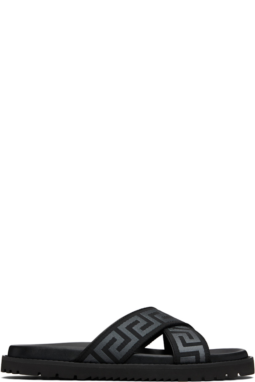Webbing slides.

· Open toe
· Jacquard Greek key pattern at crisscrossing straps
· Logo-embossed molded lambskin footbed
· Treaded rubber sole

Supplier color: Black/Anthracite