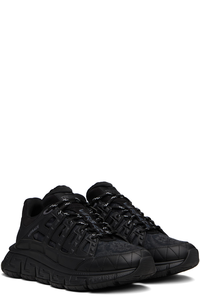 Low-top canvas and buffed calfskin sneakers.

· Jacquard Barocco pattern throughout
· Logo patch at lace-up closure and tongue
· Padded tongue and collar
· Logo and text printed at sides
· Text embossed at heel counter
· Logo embossed at heel
· Greek key-embossed textured rubber midsole
· Treaded rubber sole

Supplier color: Black