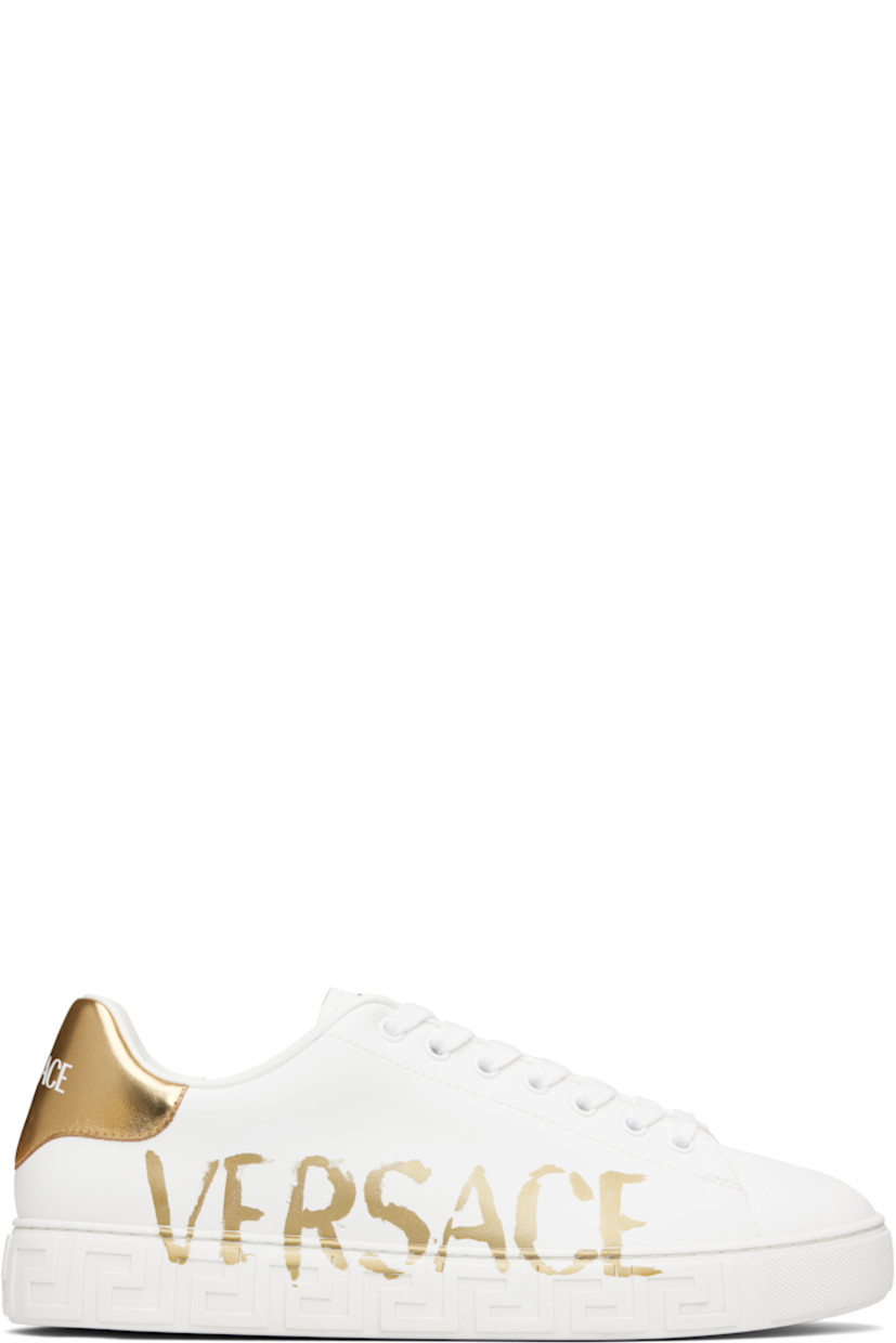 Low-top buffed faux-leather sneakers.

· Lace-up closure
· Logo patch at tongue
· Padded tongue and collar
· Logo printed at outer side
· Printed logo at metallic heel tab
· Greek key-embossed midsole
· Treaded rubber sole

Supplier color: White/Print
