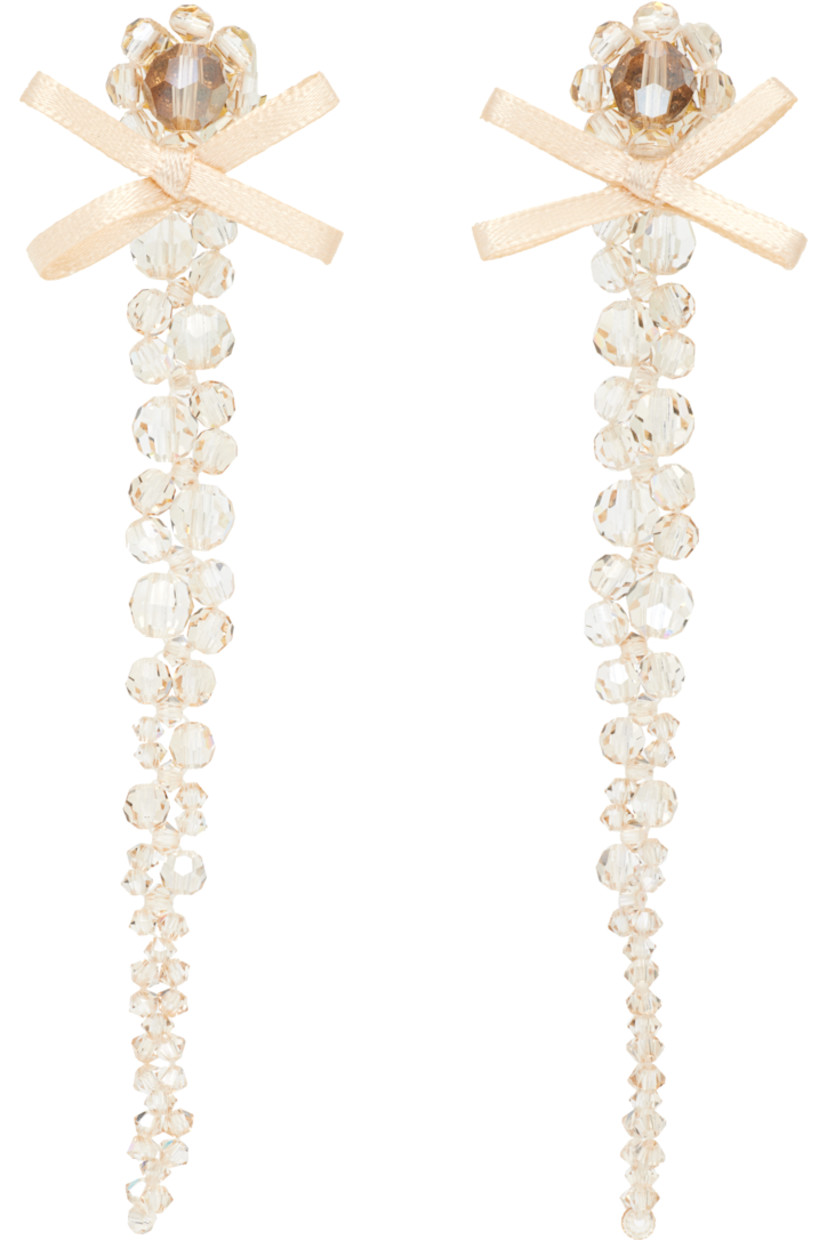 Pair of beaded glass drop earrings. 

· Satin bow at face
· Post-stud fastening 
· Gold-tone brass hardware
· H4"x W0.5"

Supplier color: Biscuit