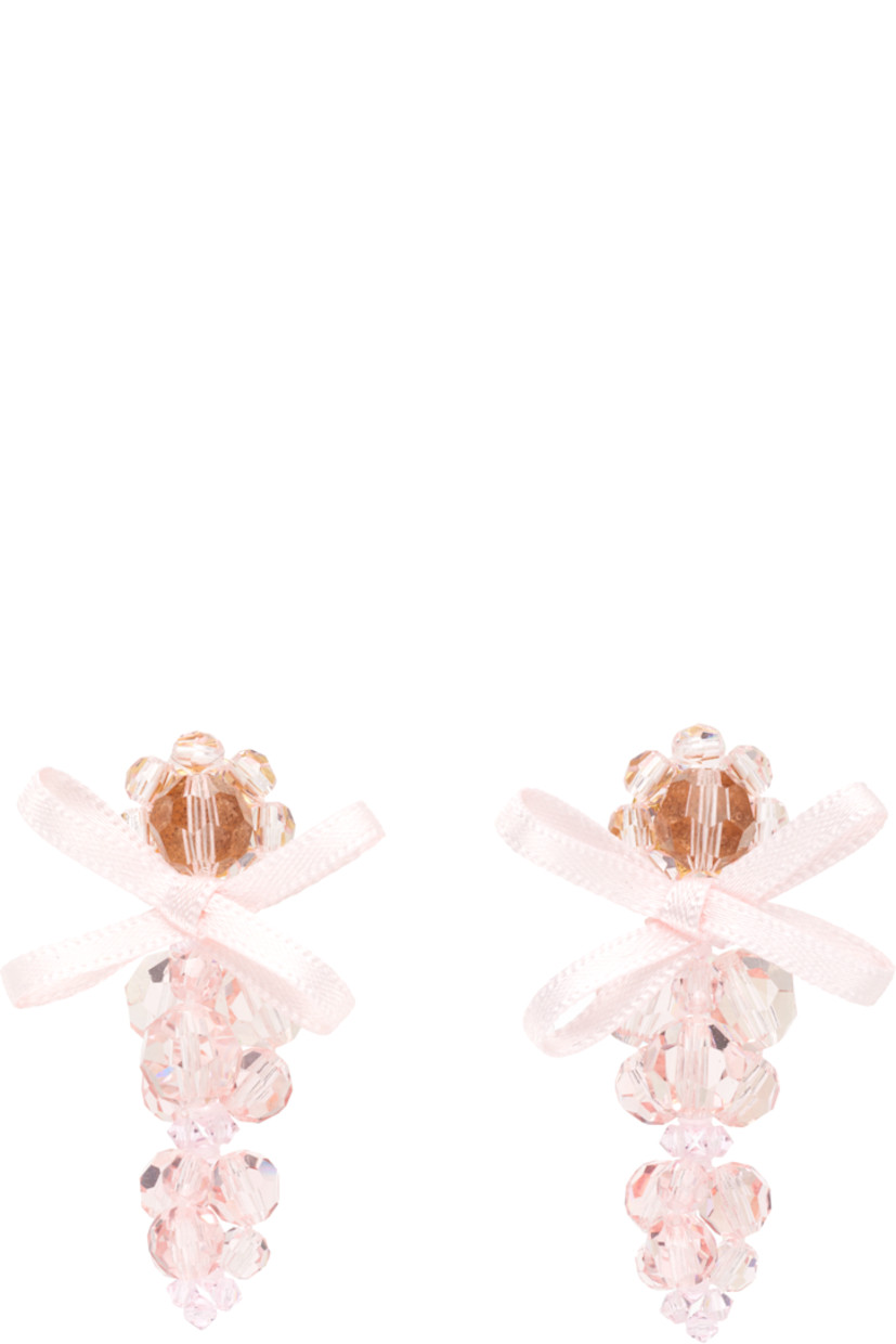 Pair of beaded glass drop earrings.

· Bow appliqué at face
· Post-stud fastening
· Gold-tone brass hardware
· H2" x W1"

Supplier color: Pale pink