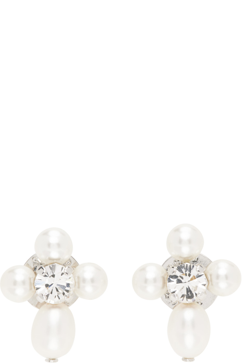 Pair of stud earrings in silver-tone brass.

· Freshwater pearls and prong-set glass crystal at face
· Post-stud fastening 
· H0.75" x W0.5"

Supplier color: Pearl/Crystal