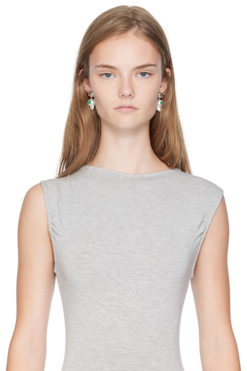 Pair of drop earrings in palladium-plated brass.

· Graphic-printed freshwater pearl at drop
· Post-stud fastening
· H1.5" x W0.75"

Part of the Jiwinaia x Rilakkuma collaboration.

Supplier color: Silver