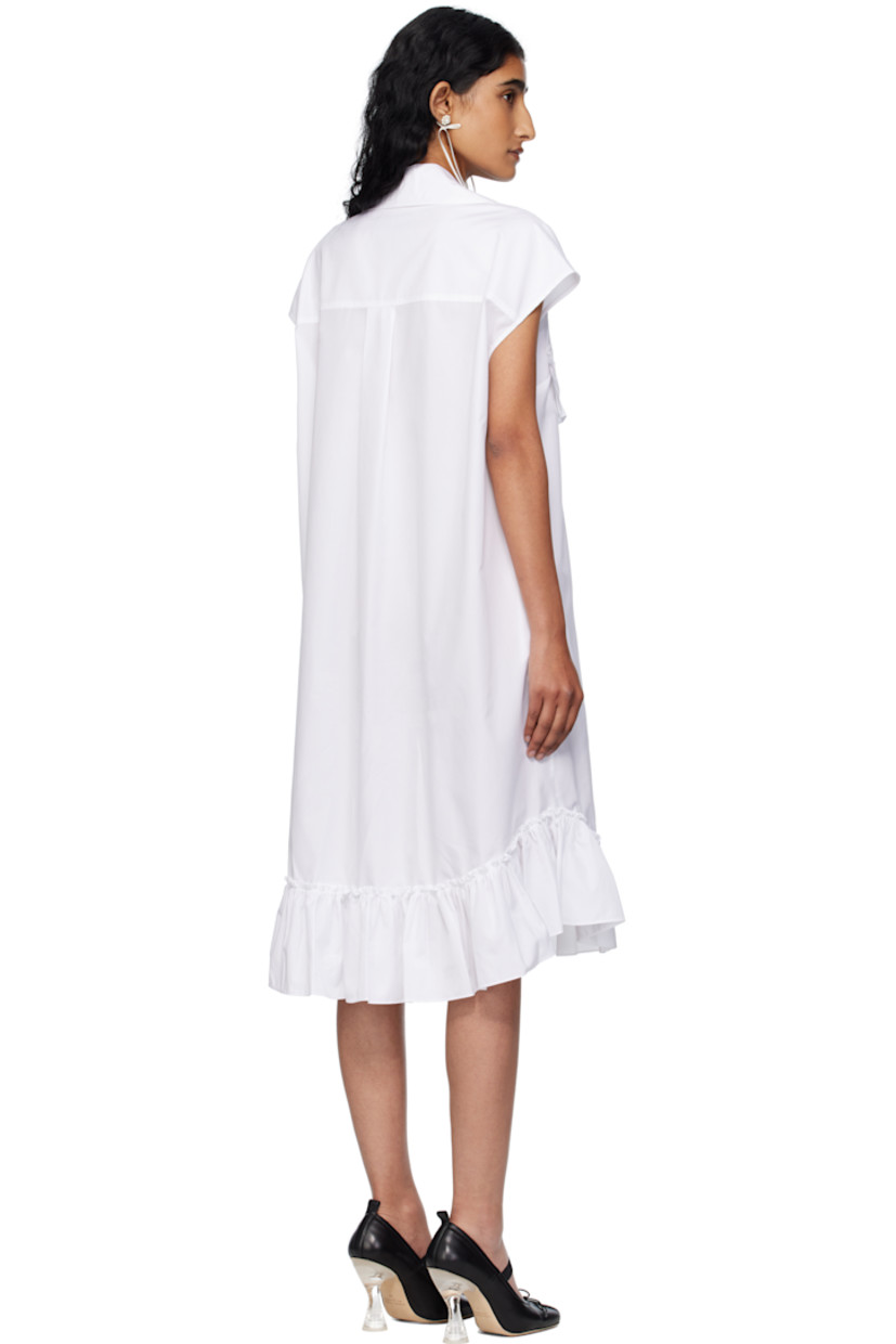 Cotton poplin midi dress.

· Spread collar
· Button closure with extended placket
· Ruffled trim at chest and hem
· Shirttail hem
· Box pleat at back yoke

Supplier color: White