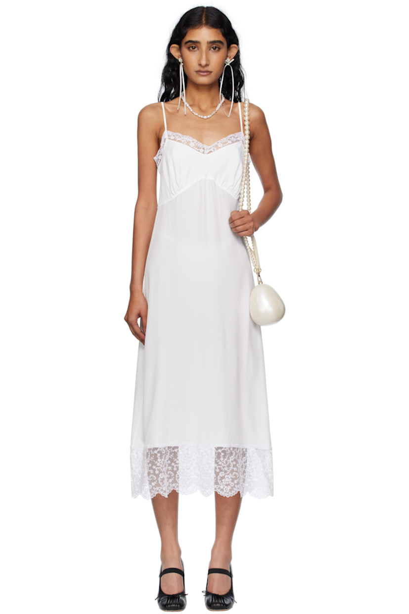 Semi-sheer crêpe de chine midi dress.

· Lace trim at sweetheart neck and hem
· Gathering at cups
· Adjustable spaghetti straps

Supplier color: Ivory