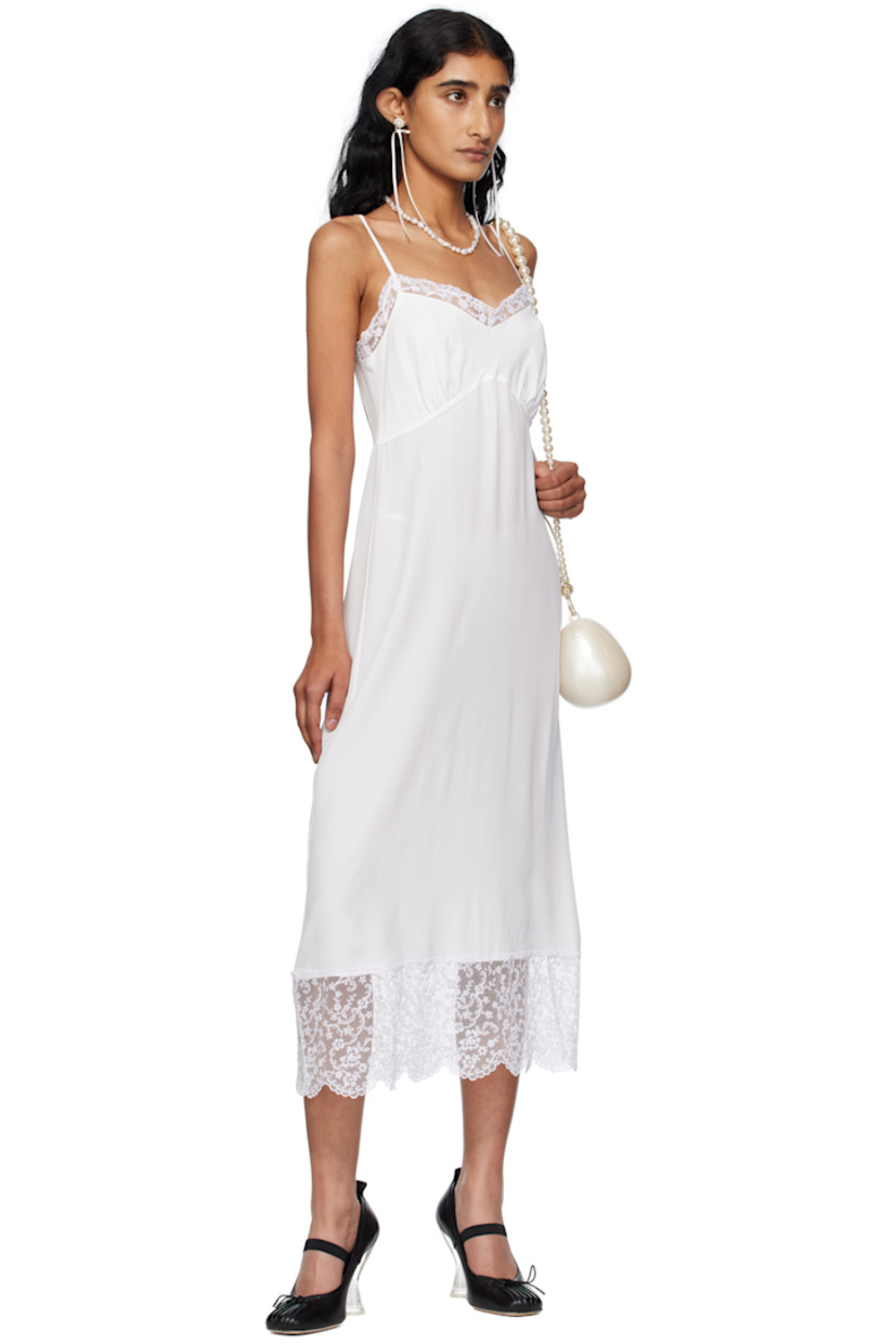 Semi-sheer crêpe de chine midi dress.

· Lace trim at sweetheart neck and hem
· Gathering at cups
· Adjustable spaghetti straps

Supplier color: Ivory