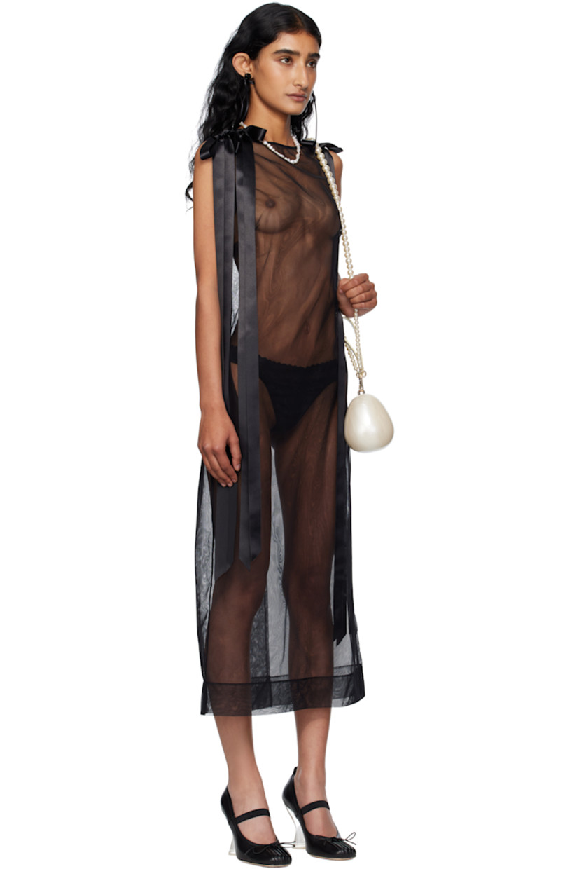 Sheer nylon tulle midi dress.

· Boatneck
· Darts at chest
· Seam pockets
· Bow appliqués at shoulders
· Zip closure at back
· Central vent at back hem

Supplier color: Black
