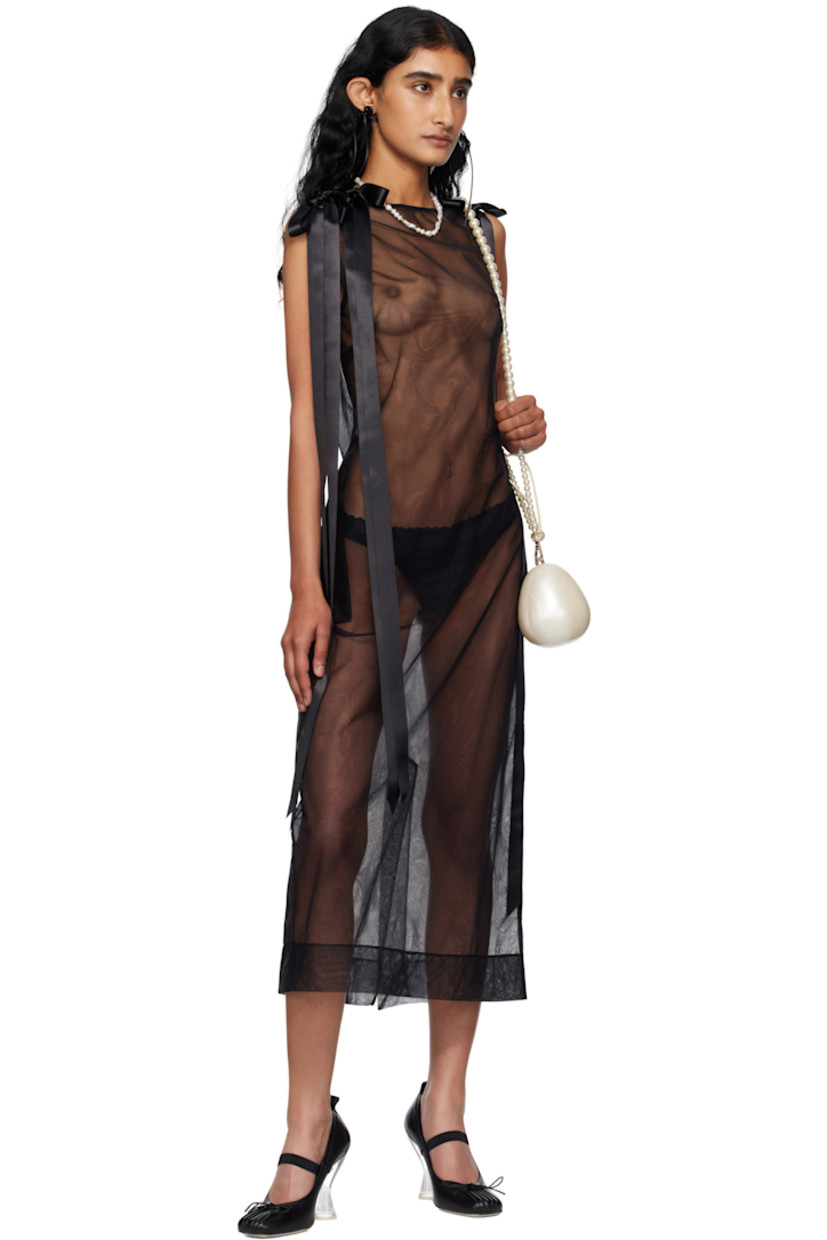 Sheer nylon tulle midi dress.

· Boatneck
· Darts at chest
· Seam pockets
· Bow appliqués at shoulders
· Zip closure at back
· Central vent at back hem

Supplier color: Black