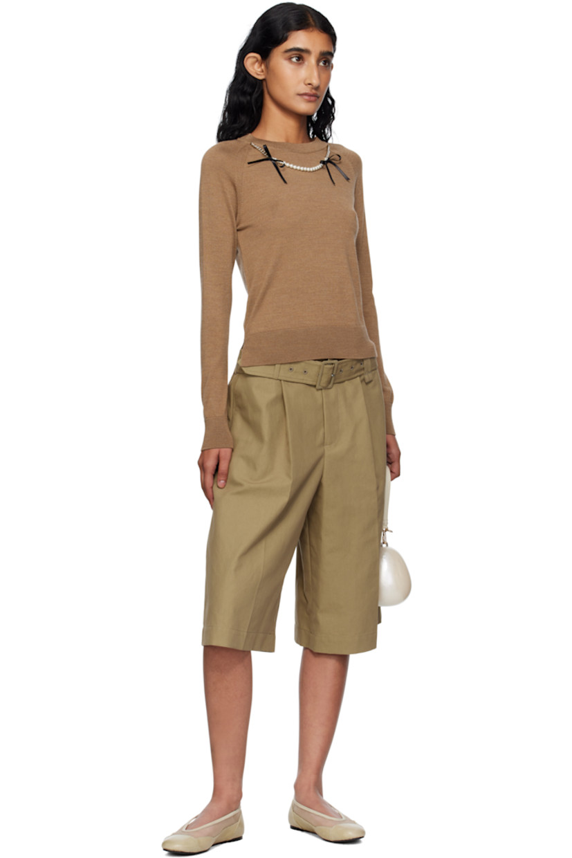 Cotton- and nylon-blend canvas shorts.

· Wide-leg
· High-rise
· Detachable cinch belt at dual belt loops
· Four-pocket styling
· Zip fly
· Pleats at front
· Creased legs

Supplier color: Stone
