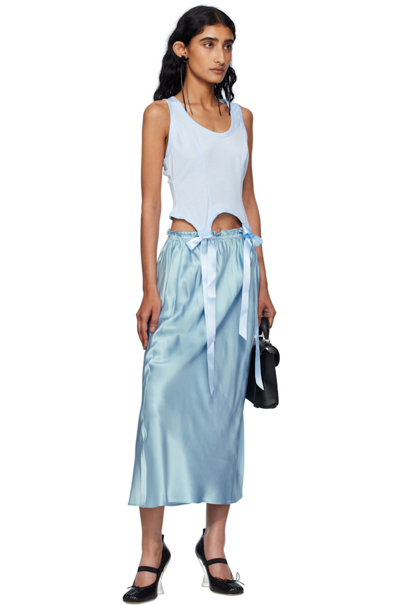 Silk satin midi skirt.

· Mid-rise
· Ruffles at elasticized waistband
· Two-pocket styling
· Gathering at side

Supplier color: Baby Blue