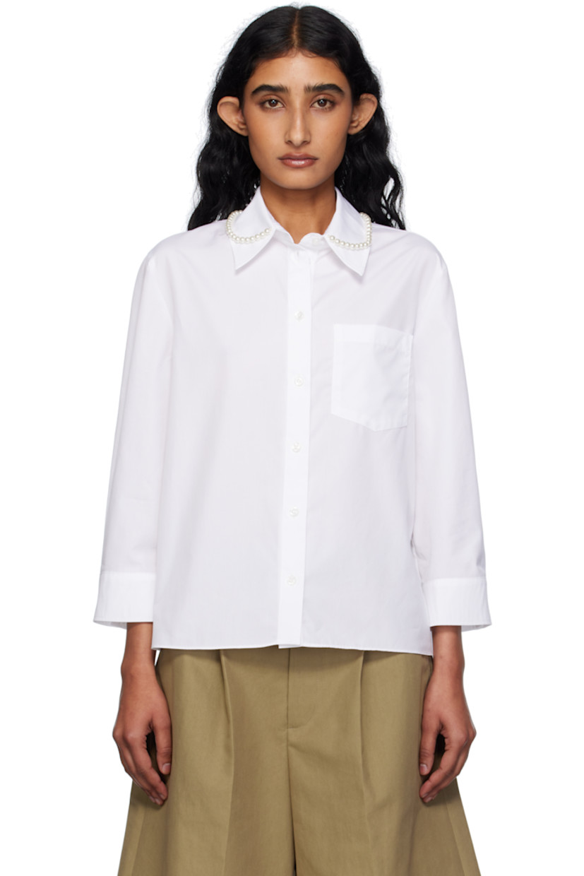 Cotton poplin shirt.

· Faux-pearl accents at spread collar
· Button closure
· Patch pocket at chest
· Cropped hem and sleeves
· Buttoned barrel cuffs
· Logo-engraved hardware

Supplier color: White/Pearl