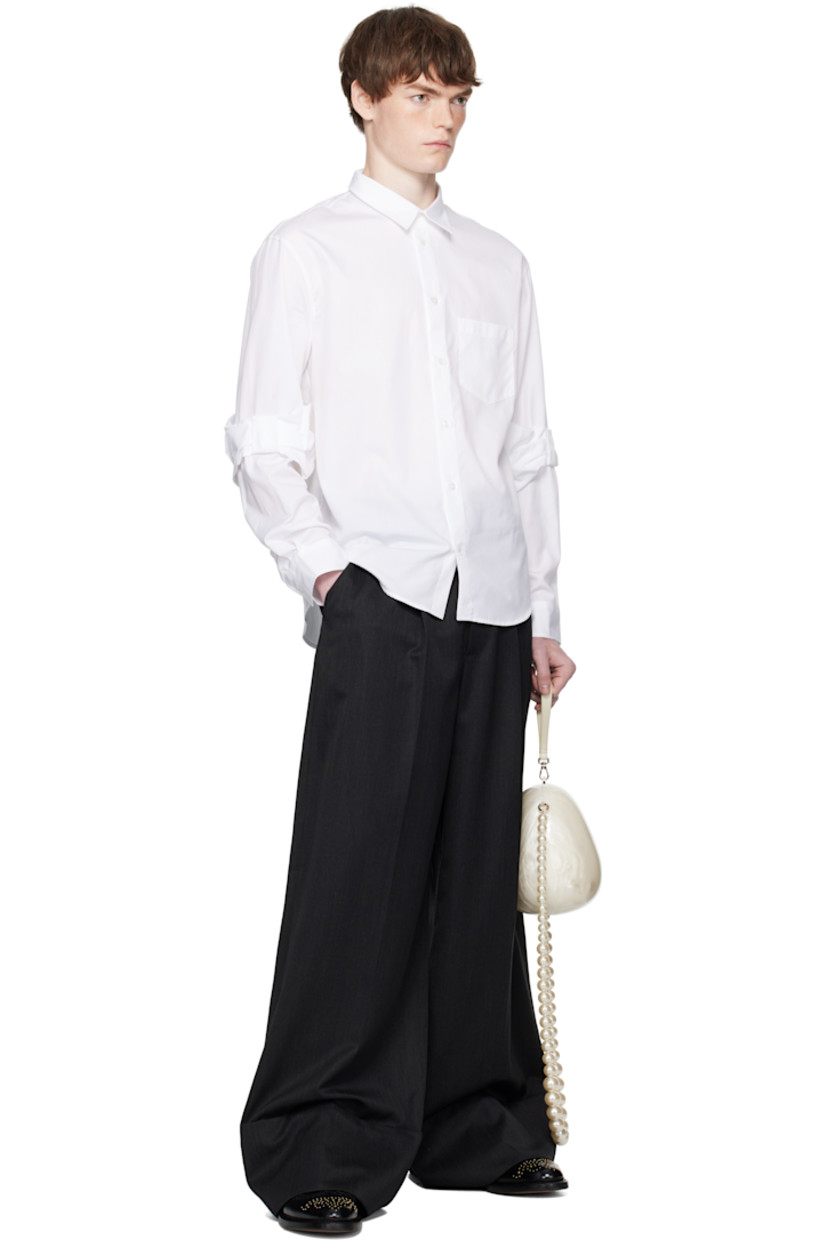 Virgin wool-blend venetian trousers.

· Wide-leg
· High-rise
· Belt loops and detachable pin-buckle belt
· Four-pocket styling
· Zip fly
· Pleats at front
· Creased legs
· Rolled cuffs

Supplier color: Charcoal