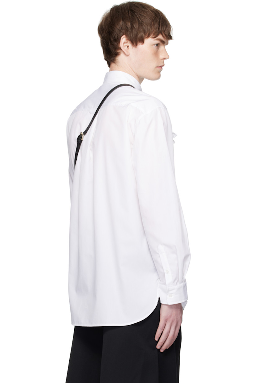 Cotton poplin shirt.

· Spread collar
· Button closure
· Ruffles, lace trim, and satin ribbons at front
· Shirttail hem
· Buttoned barrel cuffs
· Locker loop and box pleat at back yoke

Supplier color: White/Ivory