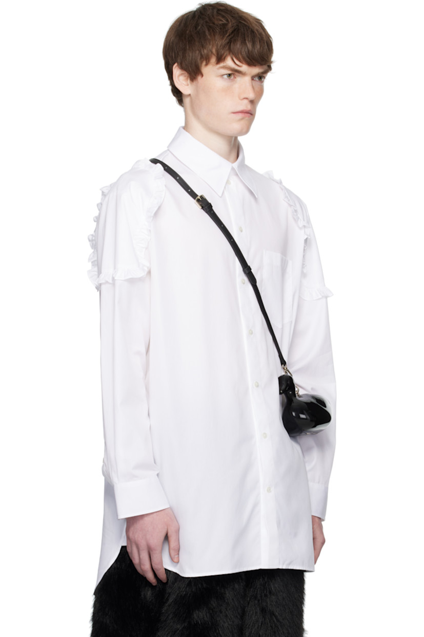 Cotton poplin shirt.

· Spread collar
· Button closure
· Patch pocket at chest
· Shirttail hem
· Ruffled trim at shoulders
· Buttoned barrel cuffs
· Box pleat at back yoke

Supplier color: White