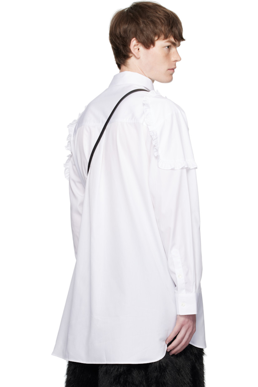 Cotton poplin shirt.

· Spread collar
· Button closure
· Patch pocket at chest
· Shirttail hem
· Ruffled trim at shoulders
· Buttoned barrel cuffs
· Box pleat at back yoke

Supplier color: White