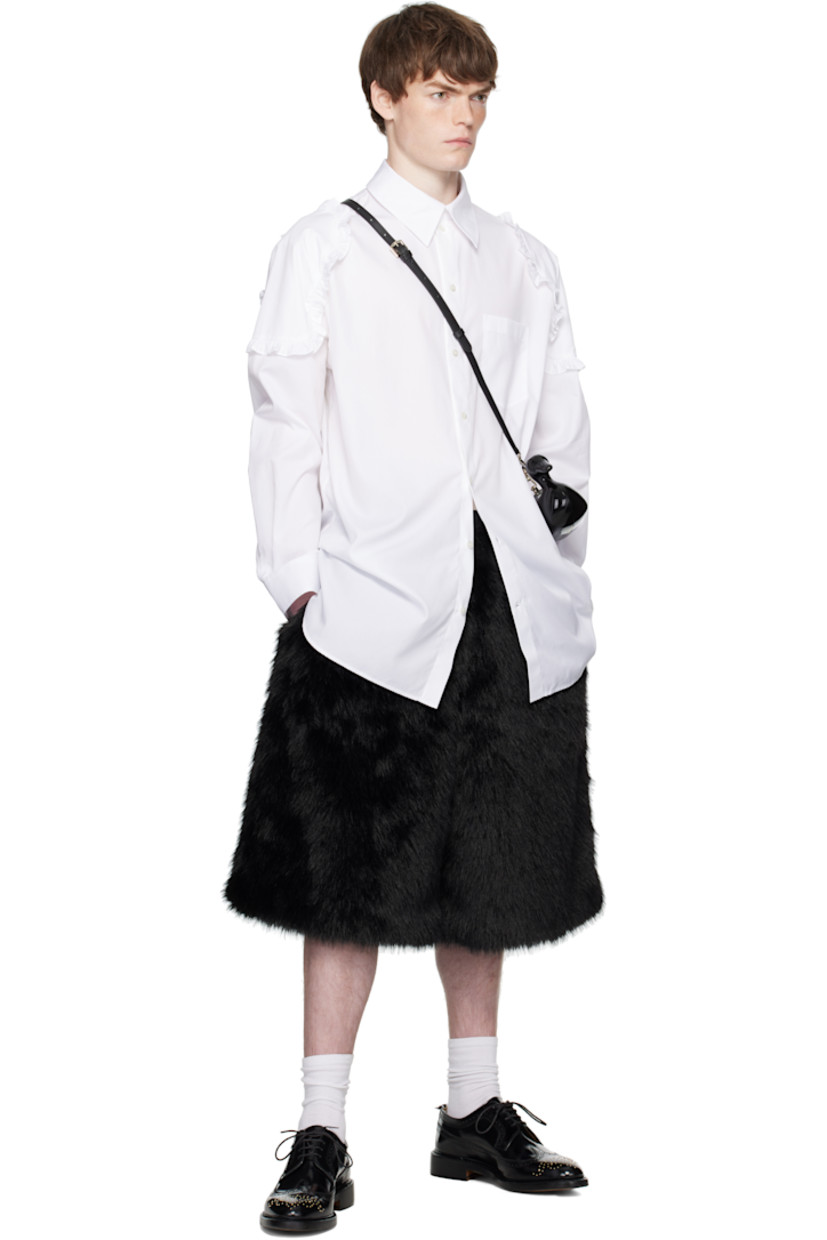 Cotton poplin shirt.

· Spread collar
· Button closure
· Patch pocket at chest
· Shirttail hem
· Ruffled trim at shoulders
· Buttoned barrel cuffs
· Box pleat at back yoke

Supplier color: White