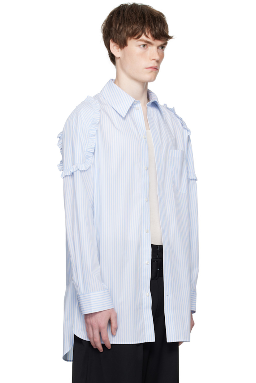 Cotton poplin shirt.

· Stripes throughout
· Spread collar
· Button closure
· Patch pocket at chest
· Shirttail hem
· Ruffled trim at shoulders
· Buttoned barrel cuffs
· Box pleat at back yoke

Supplier color: White/Blue