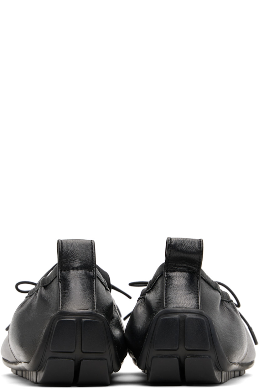 Buffed nappa leather ballerina flats.

· Pleats at toe
· Elasticized bow accent at vamp
· Crisscrossing elasticized straps at vamp
· Partially elasticized collar
· Pull-loop at heel collar
· Leather lining
· Treaded rubber sole

Supplier color: Black