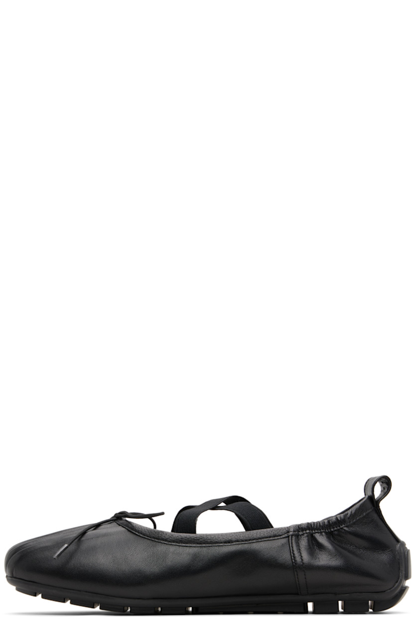 Buffed nappa leather ballerina flats.

· Pleats at toe
· Elasticized bow accent at vamp
· Crisscrossing elasticized straps at vamp
· Partially elasticized collar
· Pull-loop at heel collar
· Leather lining
· Treaded rubber sole

Supplier color: Black