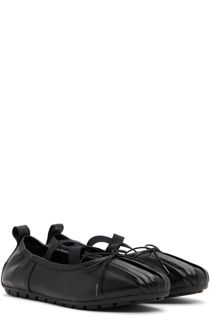 Buffed nappa leather ballerina flats.

· Pleats at toe
· Elasticized bow accent at vamp
· Crisscrossing elasticized straps at vamp
· Partially elasticized collar
· Pull-loop at heel collar
· Leather lining
· Treaded rubber sole

Supplier color: Black