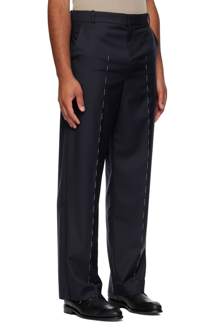 Virgin wool twill trousers.

· Belt loops
· Four-pocket styling
· Zip fly 
· Leather D-ring tab at front waist
· Creased legs
· Unfinished hem
· Contrast stitching in white 

Supplier color: Navy