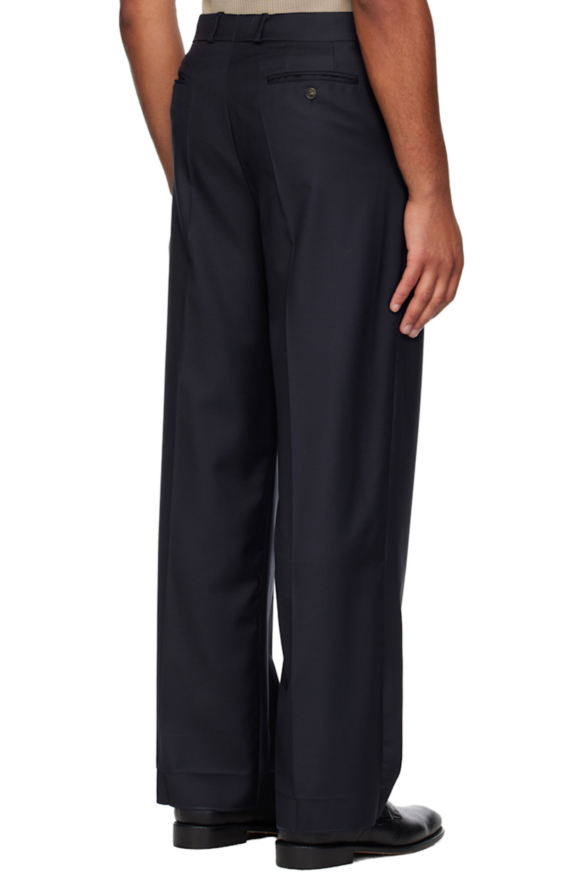 Virgin wool twill trousers.

· Belt loops
· Four-pocket styling
· Zip fly 
· Leather D-ring tab at front waist
· Creased legs
· Unfinished hem
· Contrast stitching in white 

Supplier color: Navy