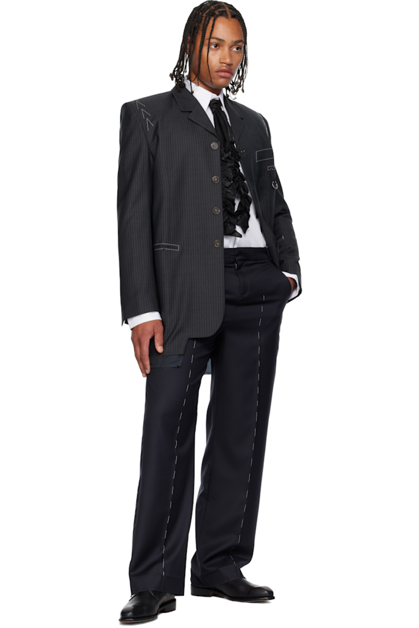 Virgin wool twill trousers.

· Belt loops
· Four-pocket styling
· Zip fly 
· Leather D-ring tab at front waist
· Creased legs
· Unfinished hem
· Contrast stitching in white 

Supplier color: Navy