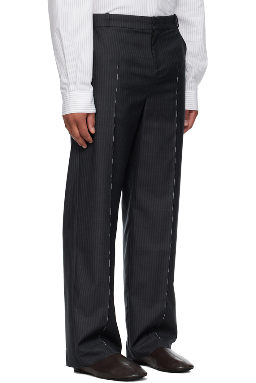 Virgin wool twill trousers.

· Stripes throughout 
· Belt loops
· Four-pocket styling
· Zip fly 
· Leather D-ring tab at front waist
· Creased legs
· Unfinished hem
· Contrast stitching in white 

Supplier color: Anthracite