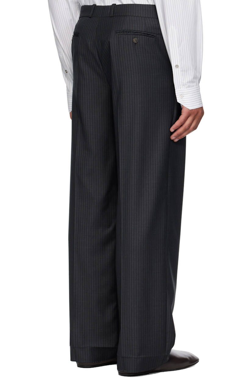 Virgin wool twill trousers.

· Stripes throughout 
· Belt loops
· Four-pocket styling
· Zip fly 
· Leather D-ring tab at front waist
· Creased legs
· Unfinished hem
· Contrast stitching in white 

Supplier color: Anthracite