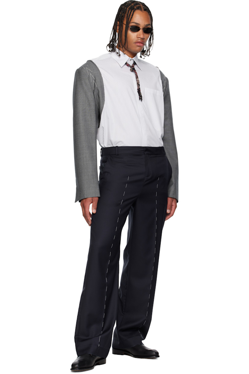Cotton poplin and plain-woven virgin wool shirt. 

· Paneled construction
· Stripes throughout 
· Spread collar 
· Button closure
· Patch pocket at chest 
· Shirttail hem 
· Raw edges at armscyes 
· Concealed buttoned surgeon's cuffs
· Pleats at back collar 

Supplier color: White grey
