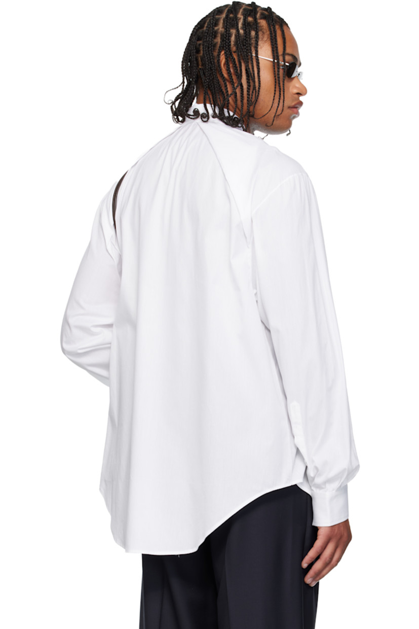 Cotton oxford cloth shirt. 

· Spread collar 
· Two-way zip closure
· Patch pocket at chest
· Shirttail hem 
· Pleats at buttoned barrel cuffs and back collar 

Supplier color: White