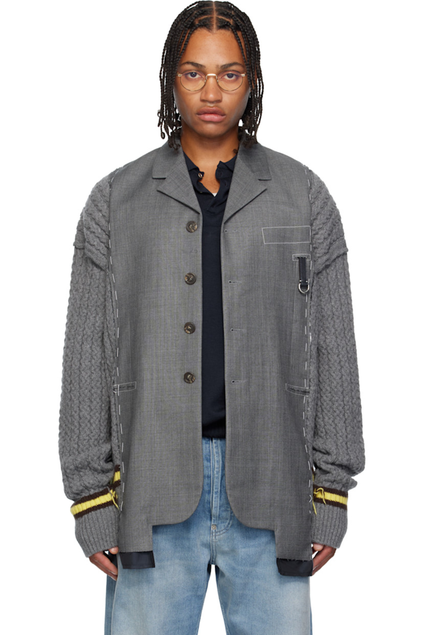 Plain-woven virgin wool and cable-knit cashmere-blend blazer. 

· Paneled construction
· Notched lapel
· Button closure 
· Leather D-ring tab at chest
· Mock welt pockets at waist
· Exposed satin lining at hem 
· Stripes at rib-knit hem and cuffs
· Central vent at back hem 
· Contrast stitching in white 

Supplier color: Light grey