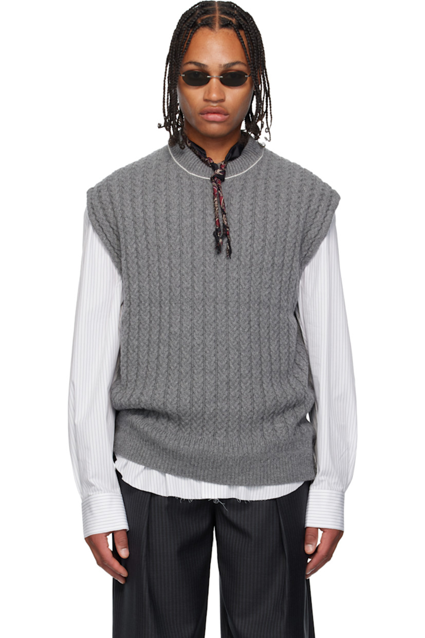 Cable-knit superfine wool- and cashmere-blend sweater vest. 

· Rib-knit crewneck and hem 
· Exposed side seams 
· Contrast stitching in white 

Supplier color: Grey