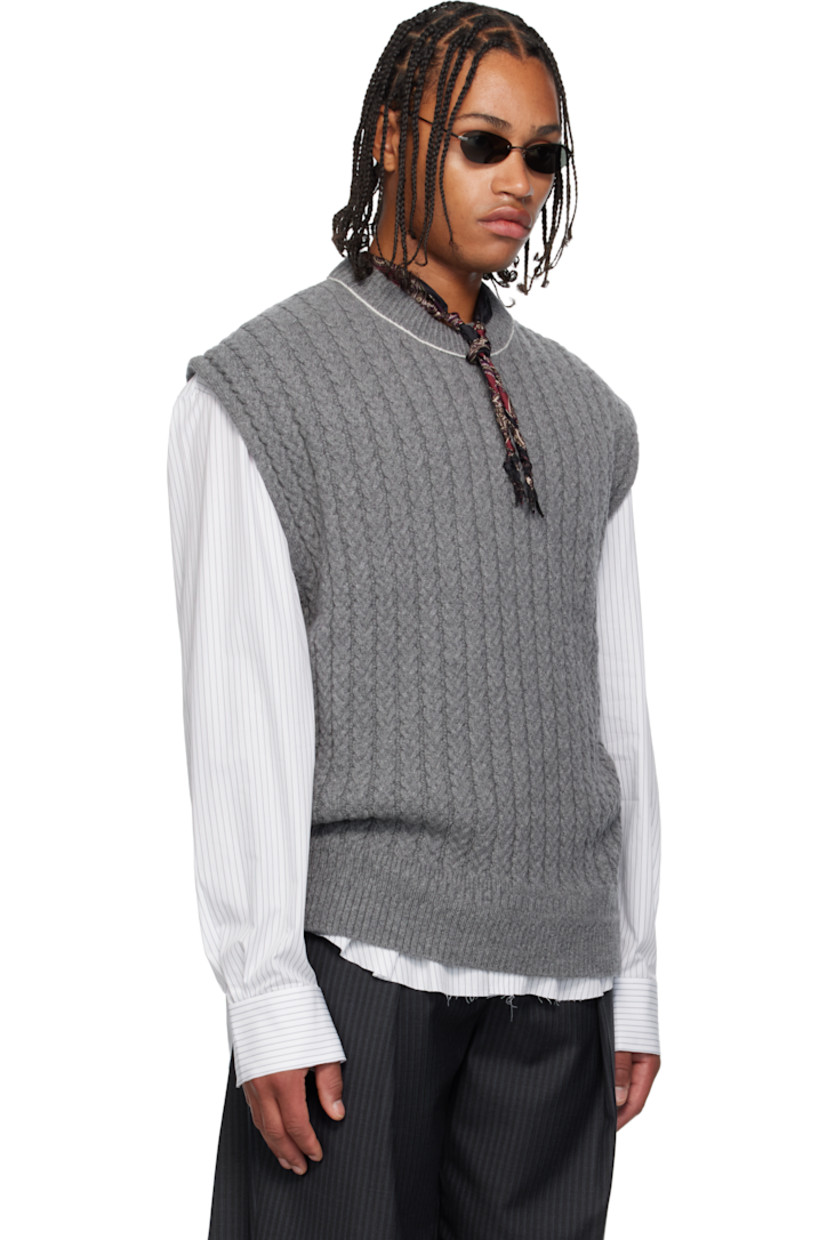 Cable-knit superfine wool- and cashmere-blend sweater vest. 

· Rib-knit crewneck and hem 
· Exposed side seams 
· Contrast stitching in white 

Supplier color: Grey