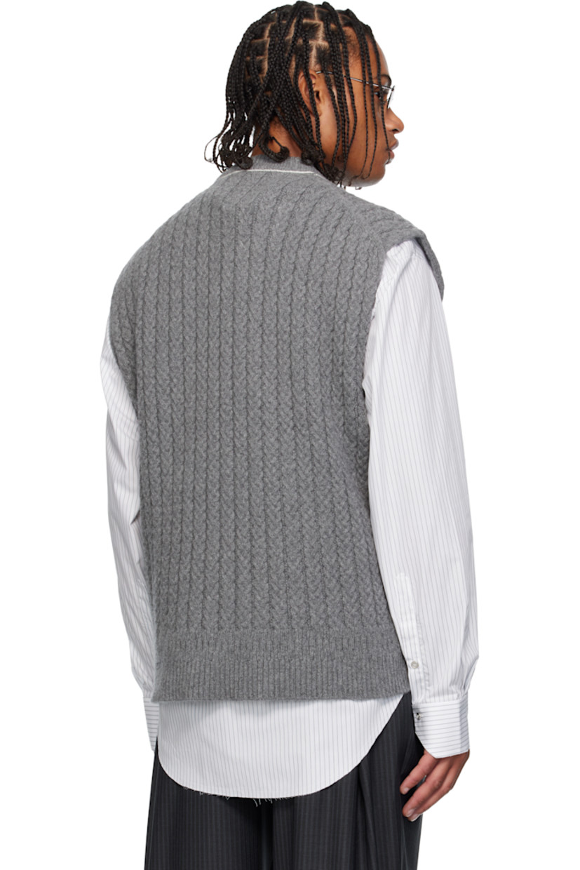 Cable-knit superfine wool- and cashmere-blend sweater vest. 

· Rib-knit crewneck and hem 
· Exposed side seams 
· Contrast stitching in white 

Supplier color: Grey