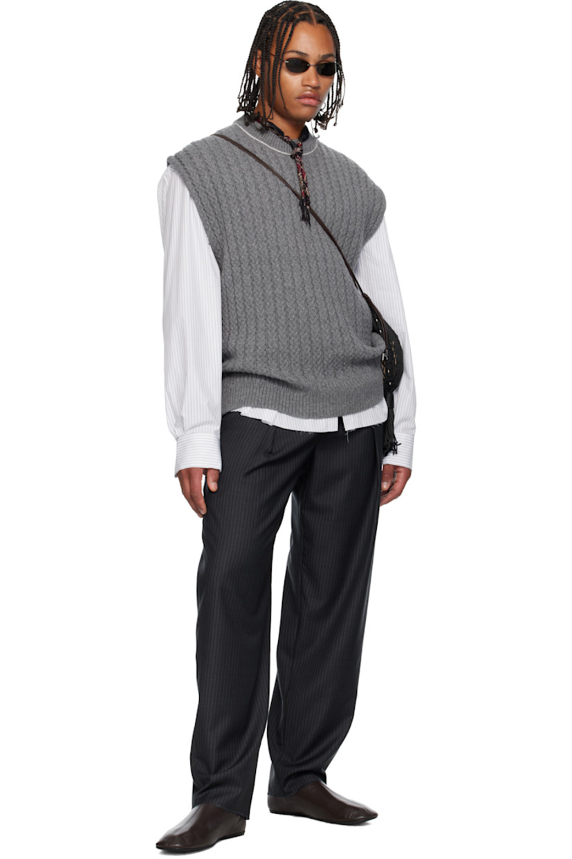 Cable-knit superfine wool- and cashmere-blend sweater vest. 

· Rib-knit crewneck and hem 
· Exposed side seams 
· Contrast stitching in white 

Supplier color: Grey