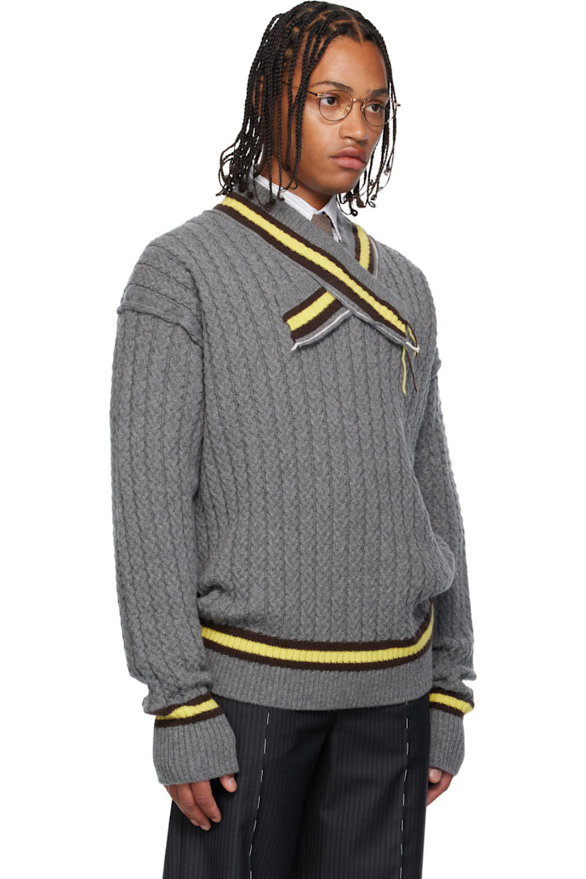 Cable-knit superfine wool- and cashmere-blend sweater. 

· Frayed edges throughout 
· Stripes at rib-knit modified V-neck, hem, and cuffs
· Dropped shoulders

Supplier color: Grey