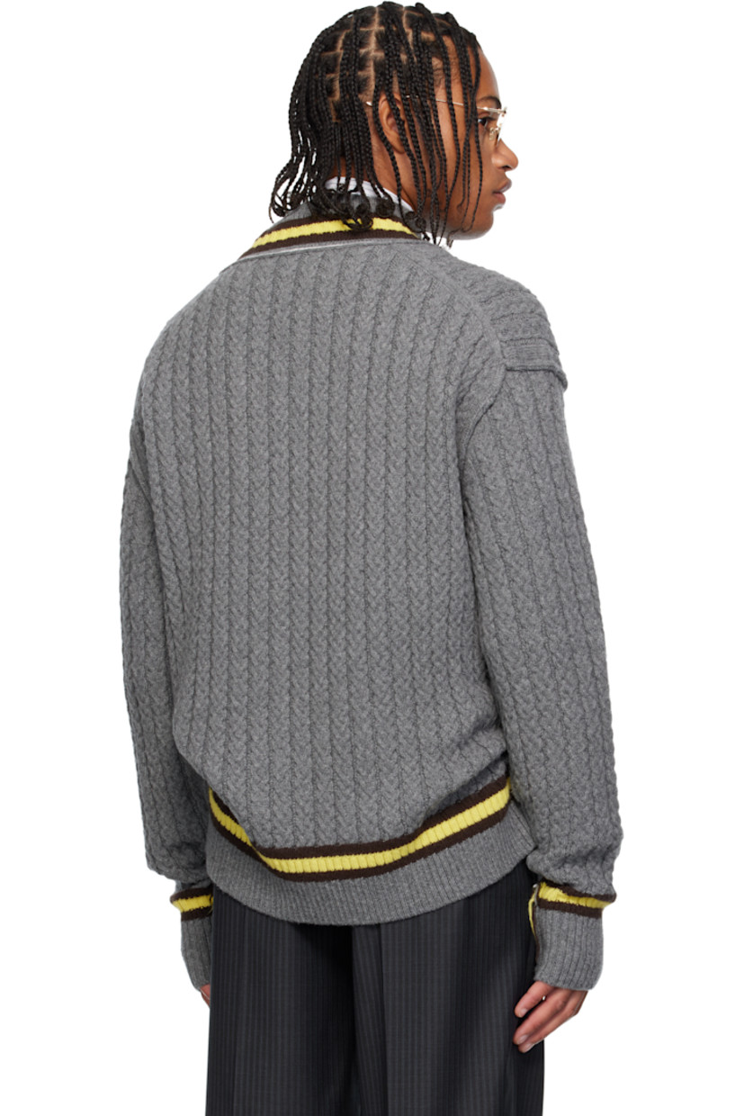 Cable-knit superfine wool- and cashmere-blend sweater. 

· Frayed edges throughout 
· Stripes at rib-knit modified V-neck, hem, and cuffs
· Dropped shoulders

Supplier color: Grey