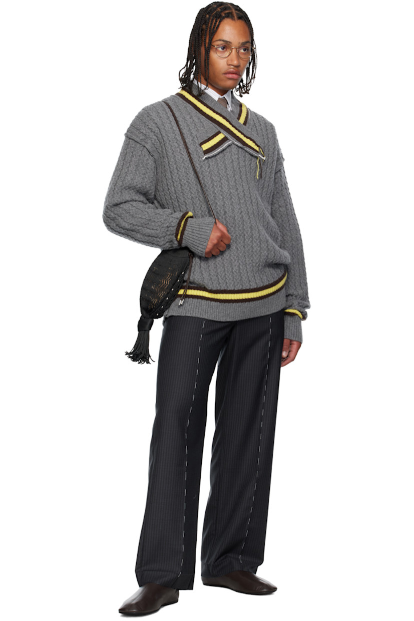 Cable-knit superfine wool- and cashmere-blend sweater. 

· Frayed edges throughout 
· Stripes at rib-knit modified V-neck, hem, and cuffs
· Dropped shoulders

Supplier color: Grey