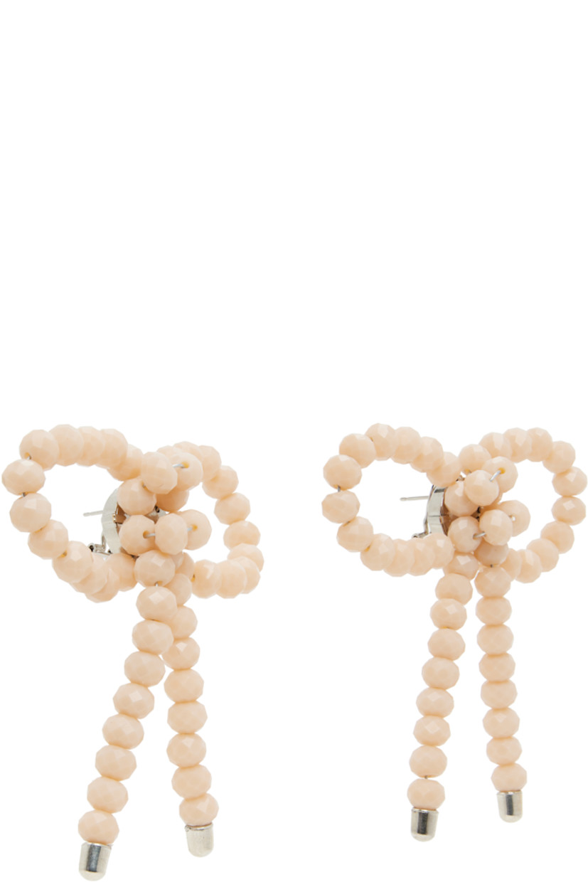 Pair of drop earrings in galvanized steel. 

· Beaded resin bow in pink at face
· Silver-tone brass post-stud fastening 
· H3.25" x W3"

Supplier color: Jade/Off white
