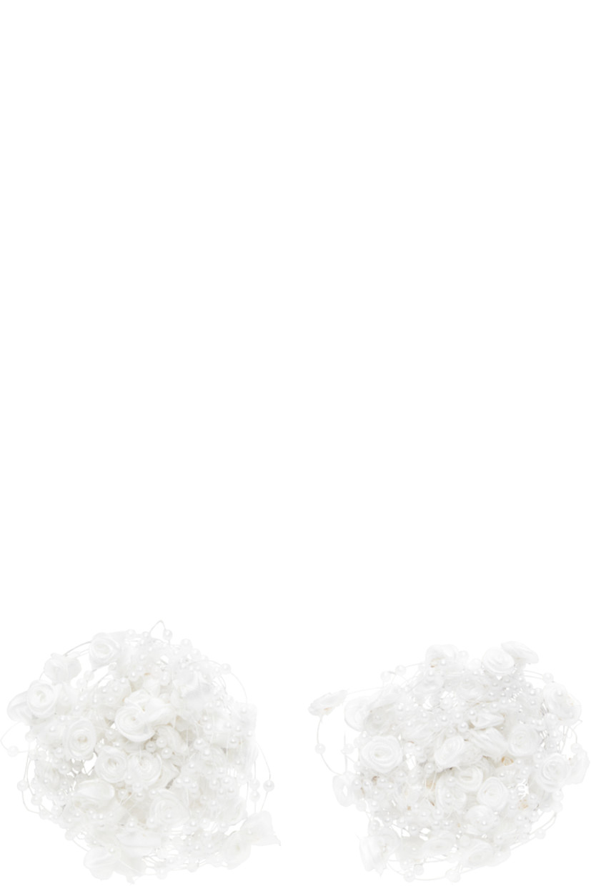 Pair of drop earrings in white resin.

· Twill floral and beaded faux pearls at face
· Silver-tone brass post-stud fastening 
· D3.5"

Supplier color: White
