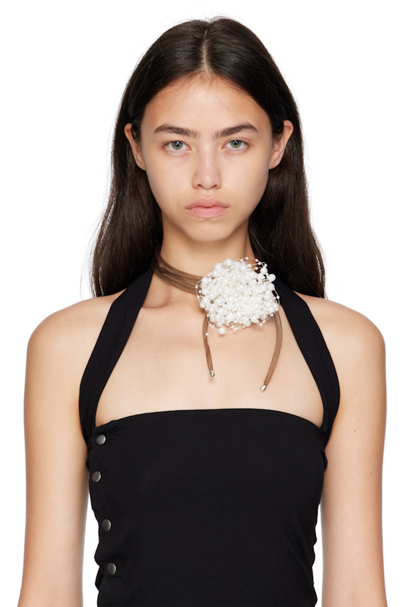 Tiered tubular fishnet choker in brown.

· Sliding beaded floral faux-pearl accent at face
· Silver-tone brass hardware at ends
· Pull-through fastening 
· D15"

Supplier color: Pearl