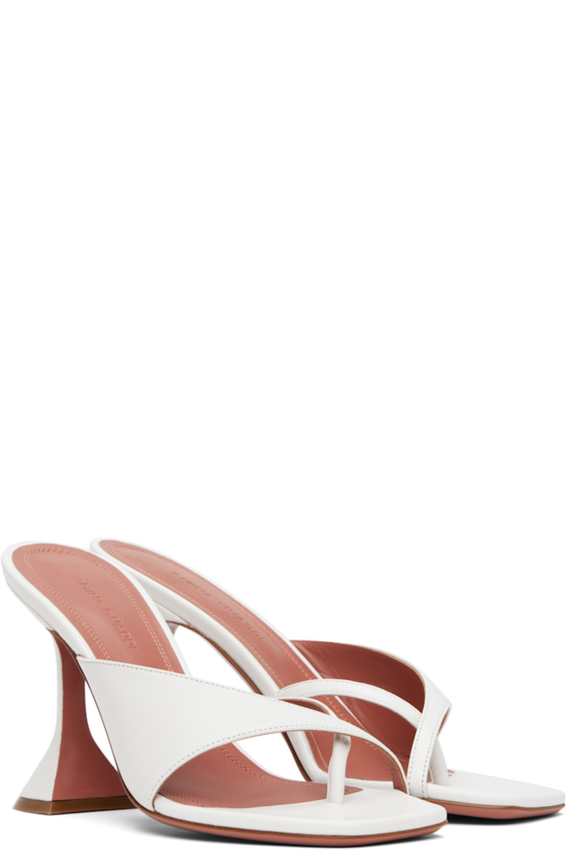 Grained nappa leather heeled sandals in white.

· Open square toe
· Thong-style strap at vamp
· Covered spool heel with rubber injection 
· Polished leather sole with rubber injection
· Heel: H3.75"

Supplier color: Nappa white