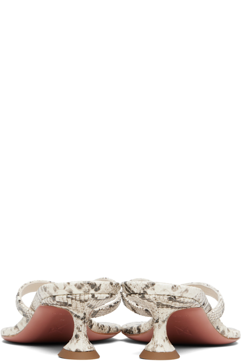 Snake-embossed goatskin heeled sandals.

· Open toe
· Thong-style strap at vamp
· Logo embossed at padded footbed
· Covered kitten heel with rubber injection
· Leather sole with rubber injection
· Heel: H1.75"

Supplier color: Print snake natural