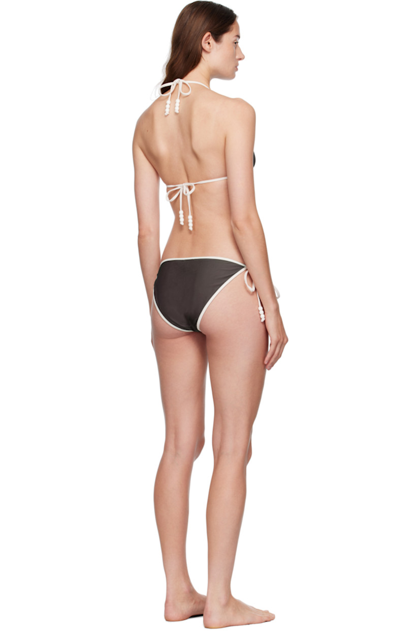 Stretch recycled jersey bikini top and bottom.

· Self-tie halter and fastening at back
· Self-tie fastening at bottom sides
· Beads at strap ends
· Fully lined
· Drawstring travel pouch included

Available exclusively at SSENSE.

Supplier color: Brown/White