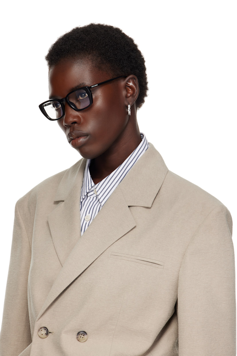 Rectangular acetate-frame optical glasses in black.

· Integrated nose pads
· Logo stamp at temples
· Includes case
· Size: 49.20 135

Supplier color: Black